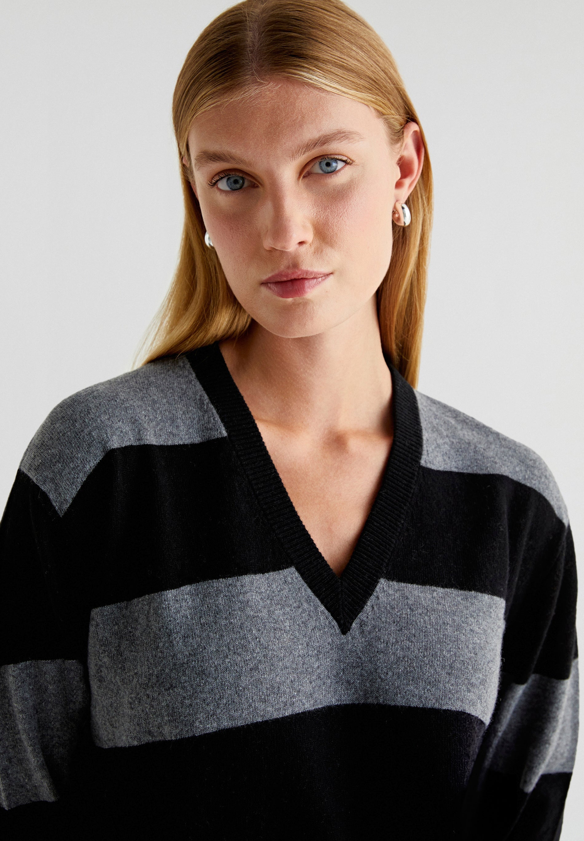 STRIPED SWEATER WITH POCKETS AND V-NECK