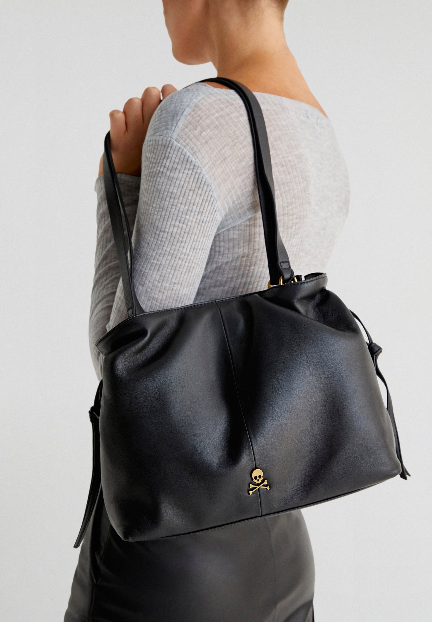 LEATHER BAG WITH DRAWSTRING STRAPS