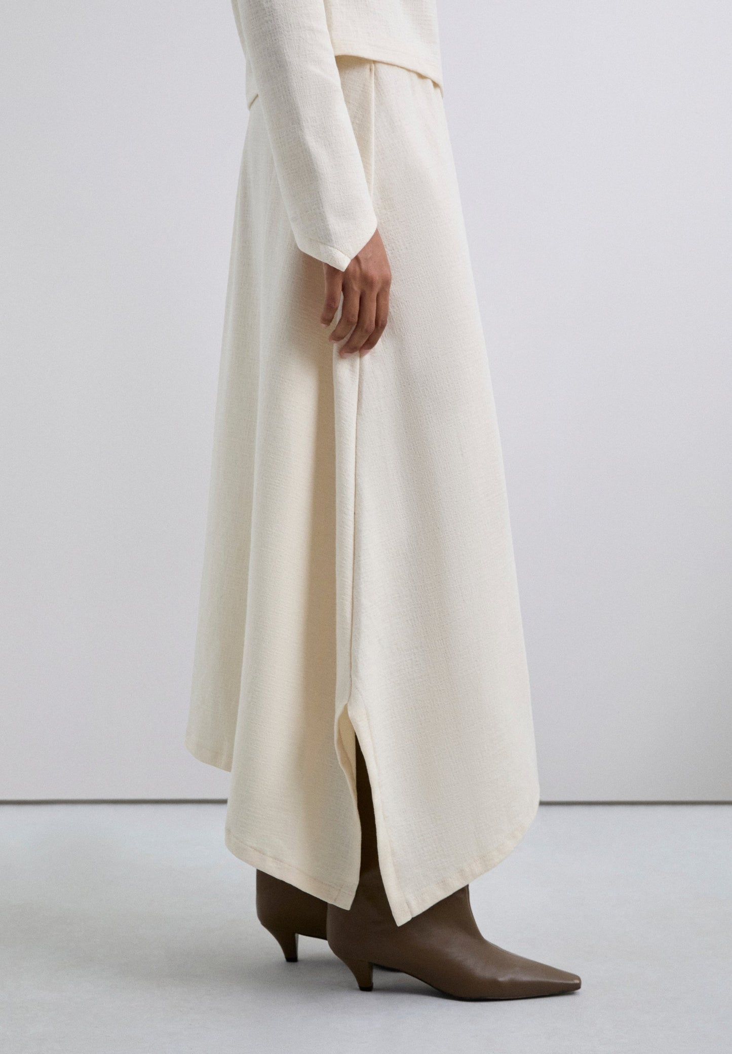 ASYMMETRIC KNIT MIDI SKIRT