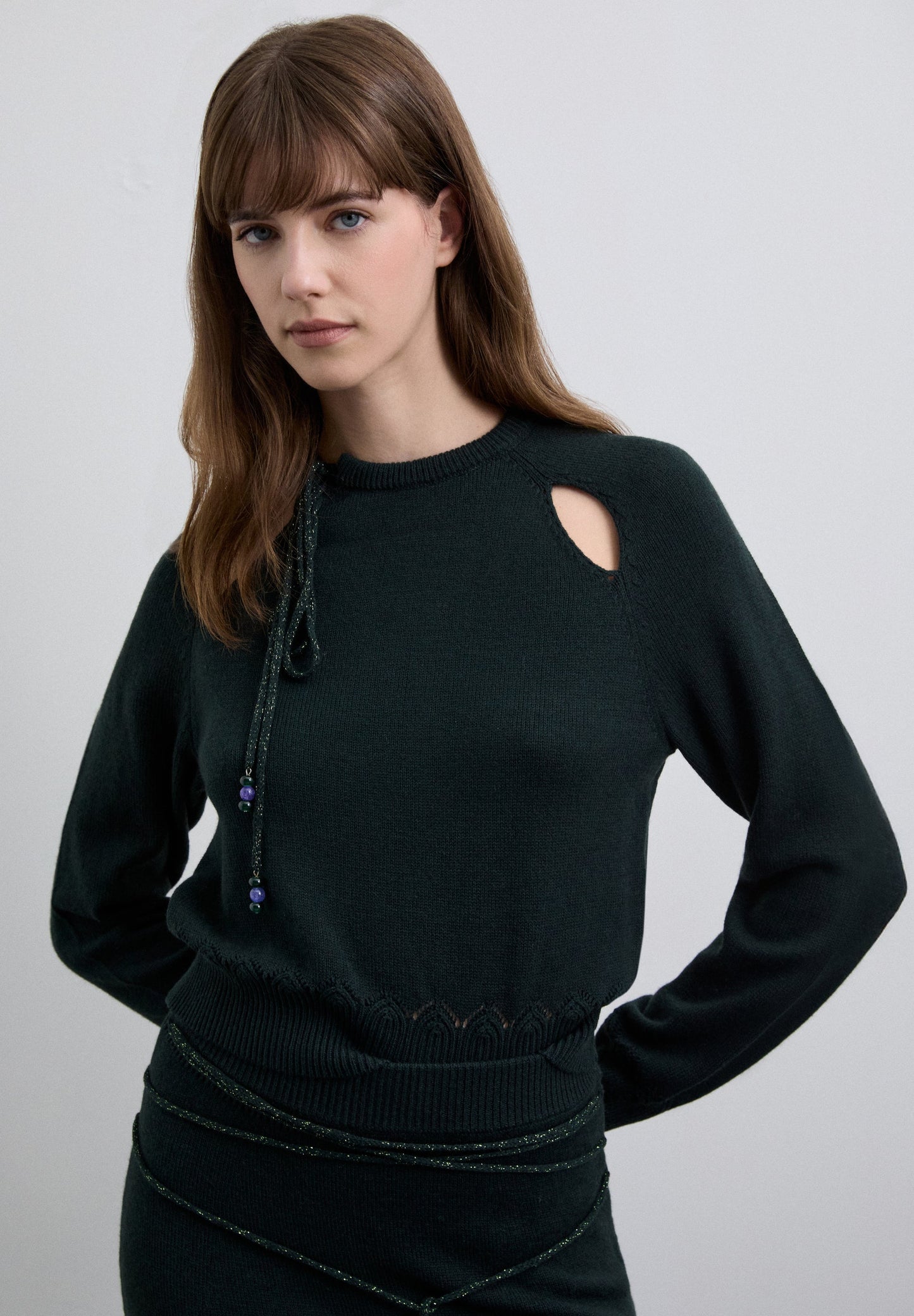 SWEATER WITH CUTOUTS AND TIE DETAIL