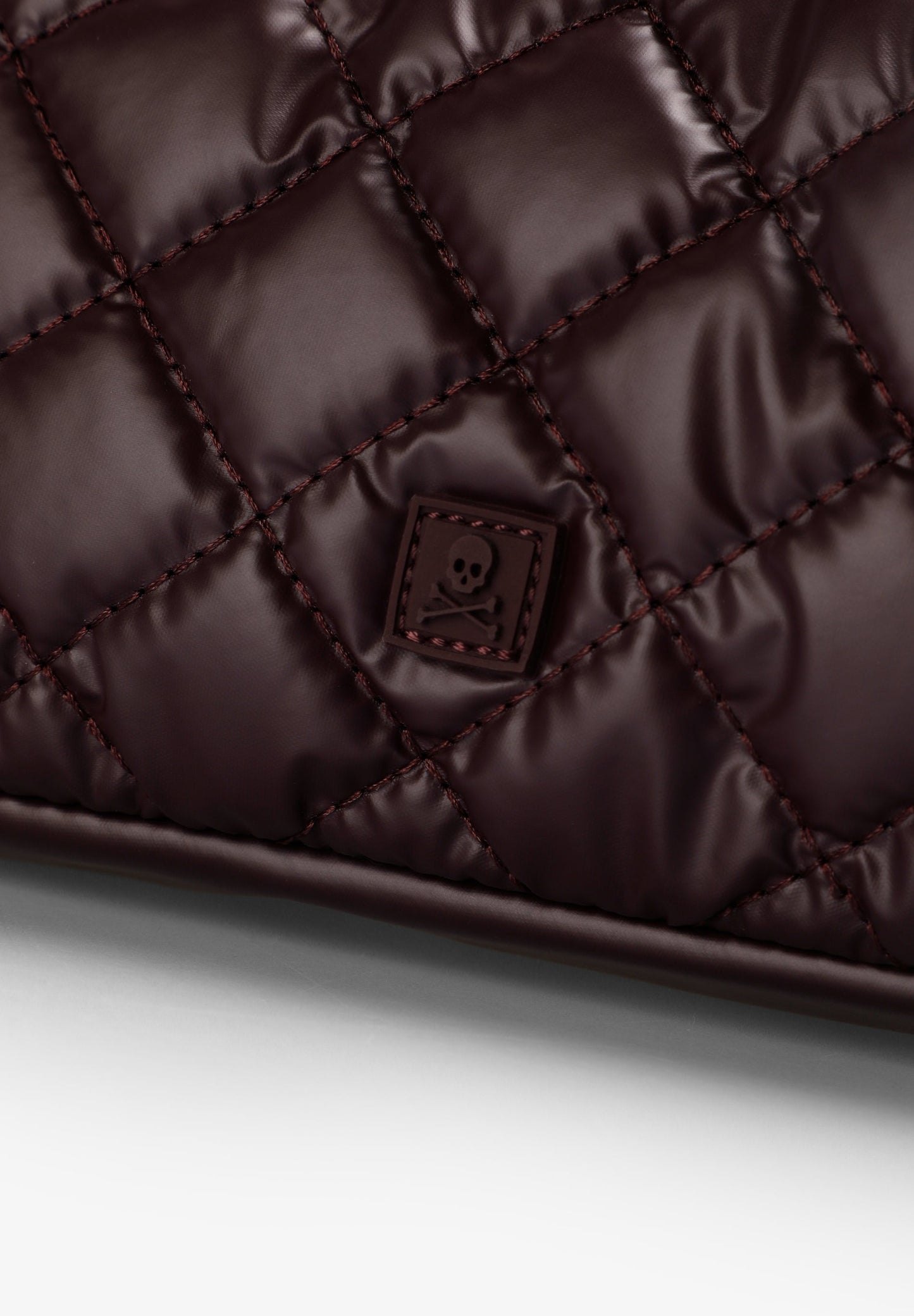 QUILTED TOILETRY BAG WITH SKULL