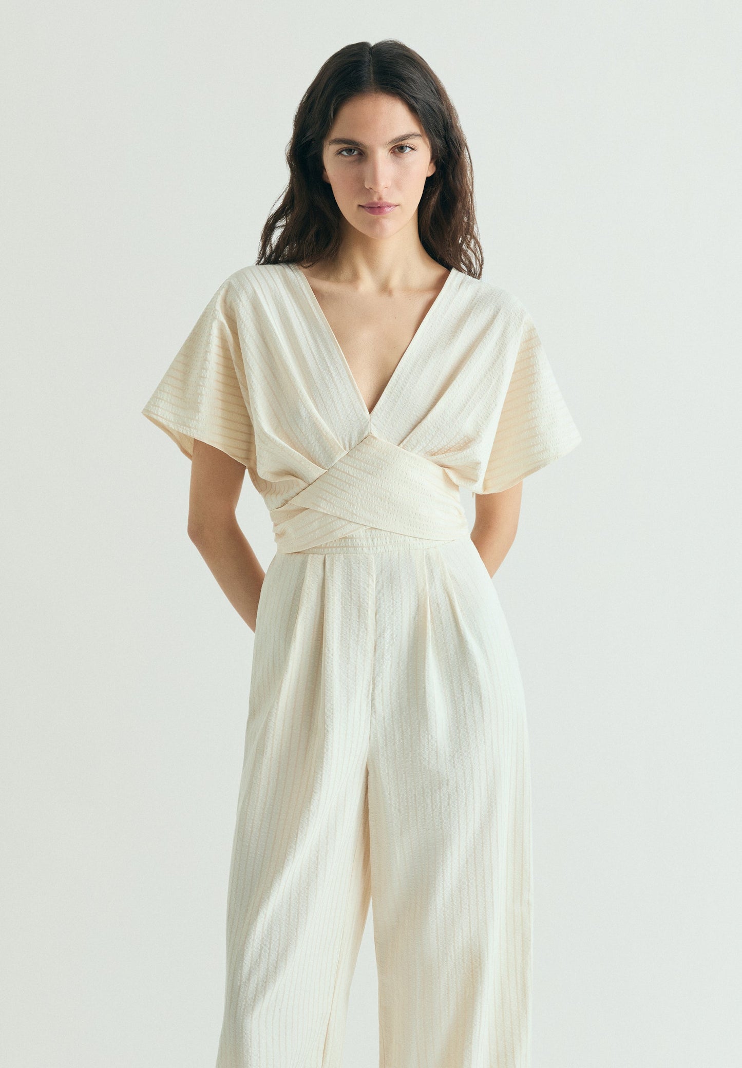 STRIPED JUMPSUIT WITH CROSSOVER WAIST
