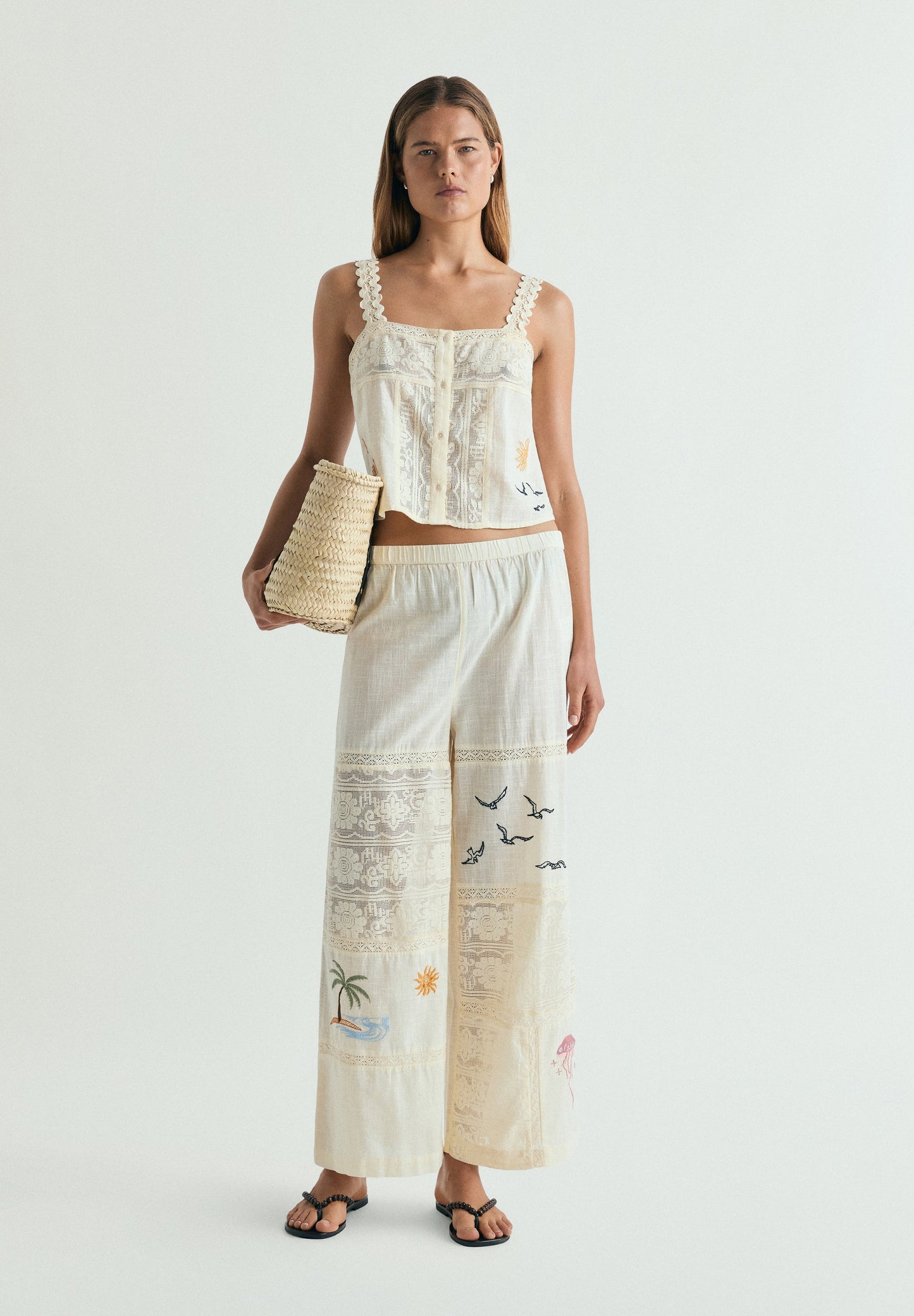 TROUSERS WITH EMBROIDERY AND LACE