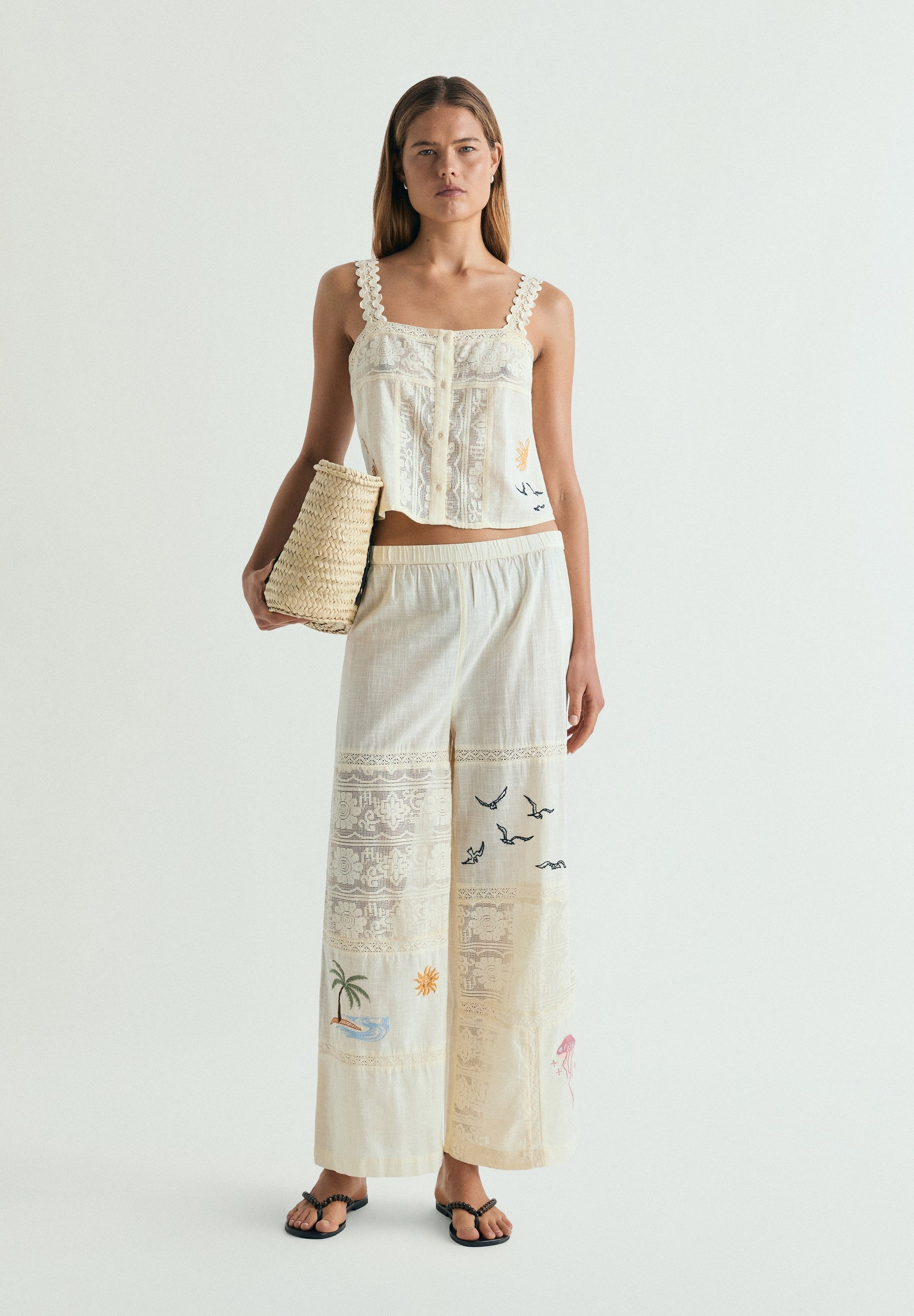 TROUSERS WITH EMBROIDERY AND LACE