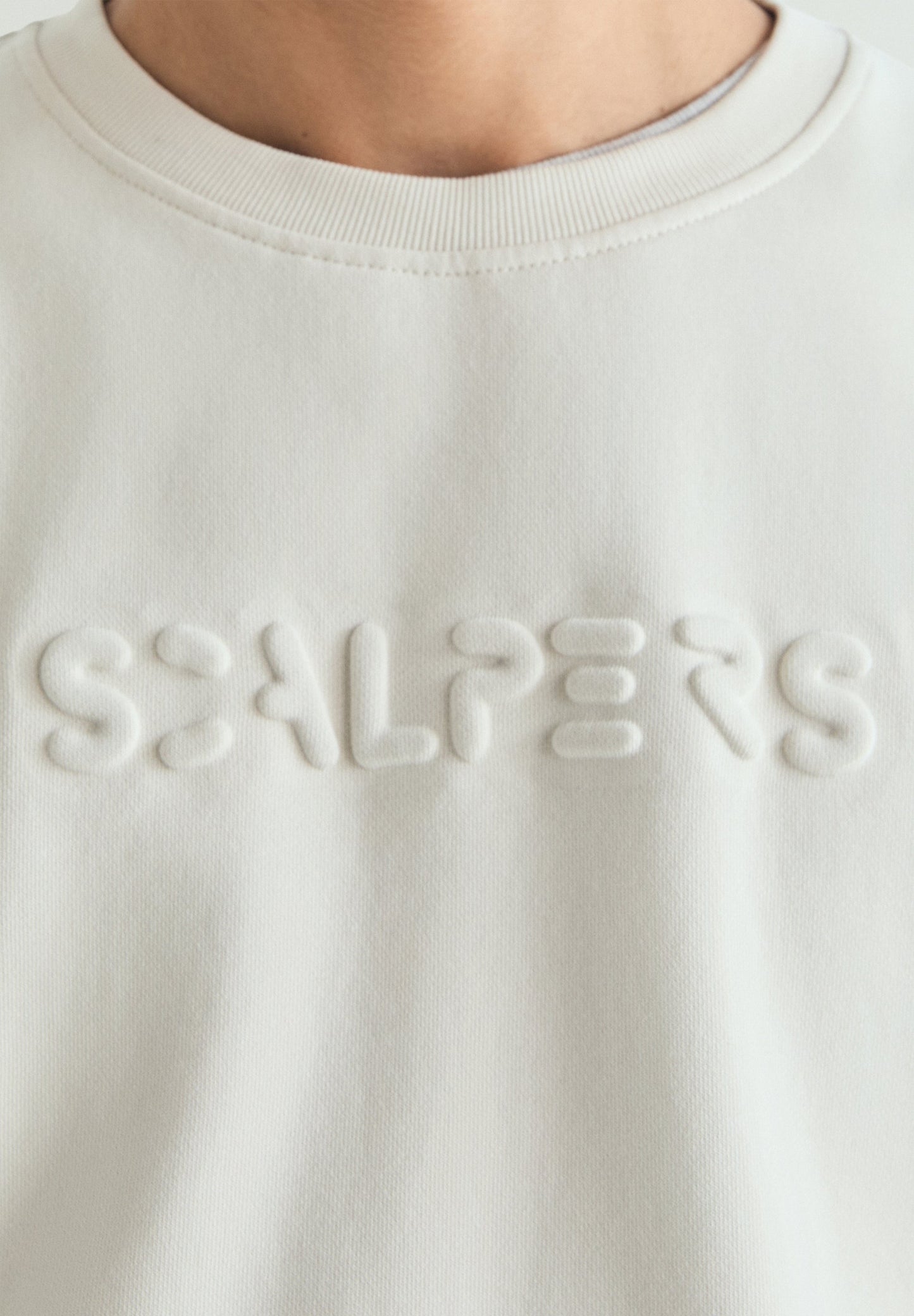 SWEATSHIRT WITH EMBOSSED SKULL