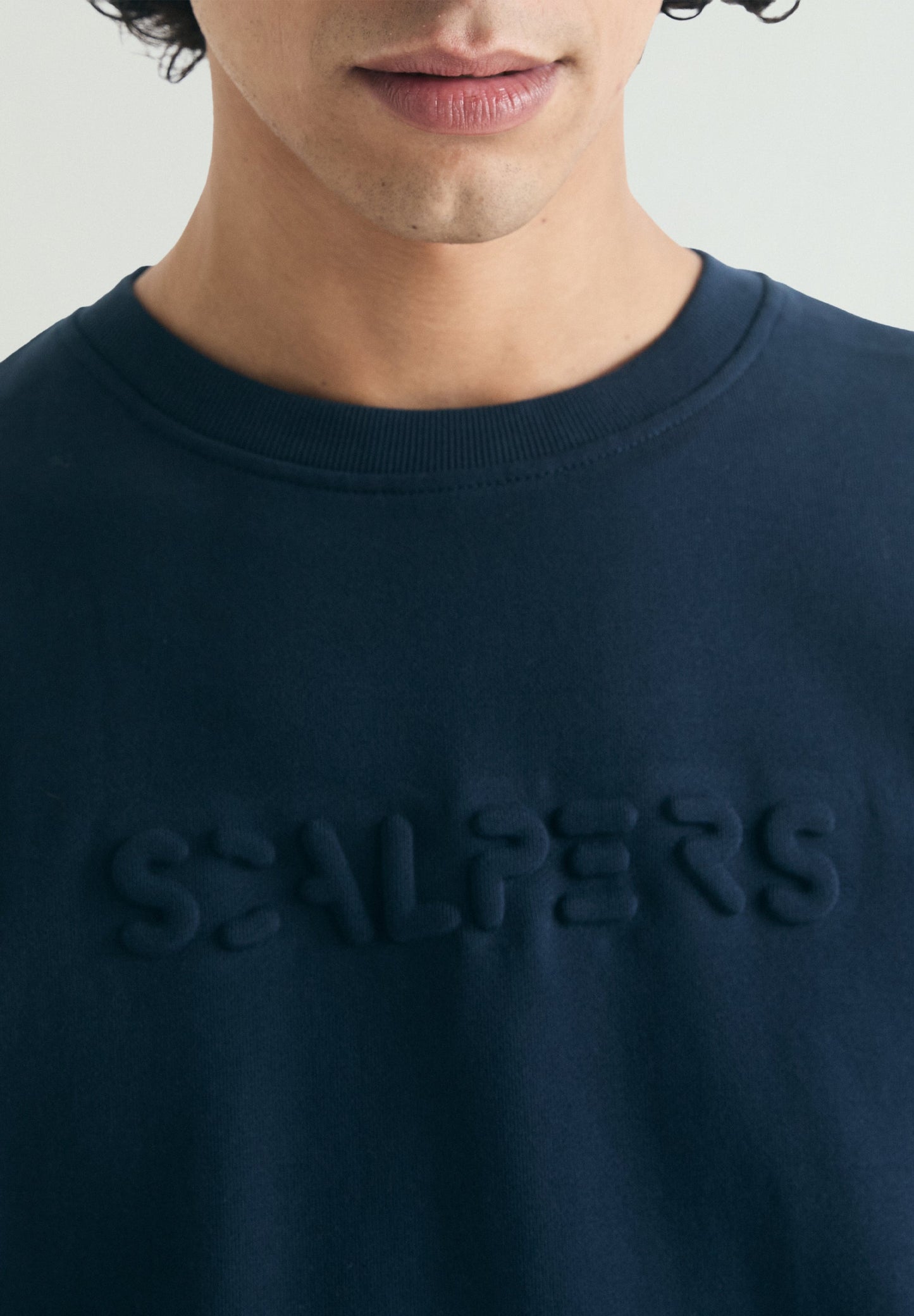 SWEATSHIRT WITH EMBOSSED SKULL