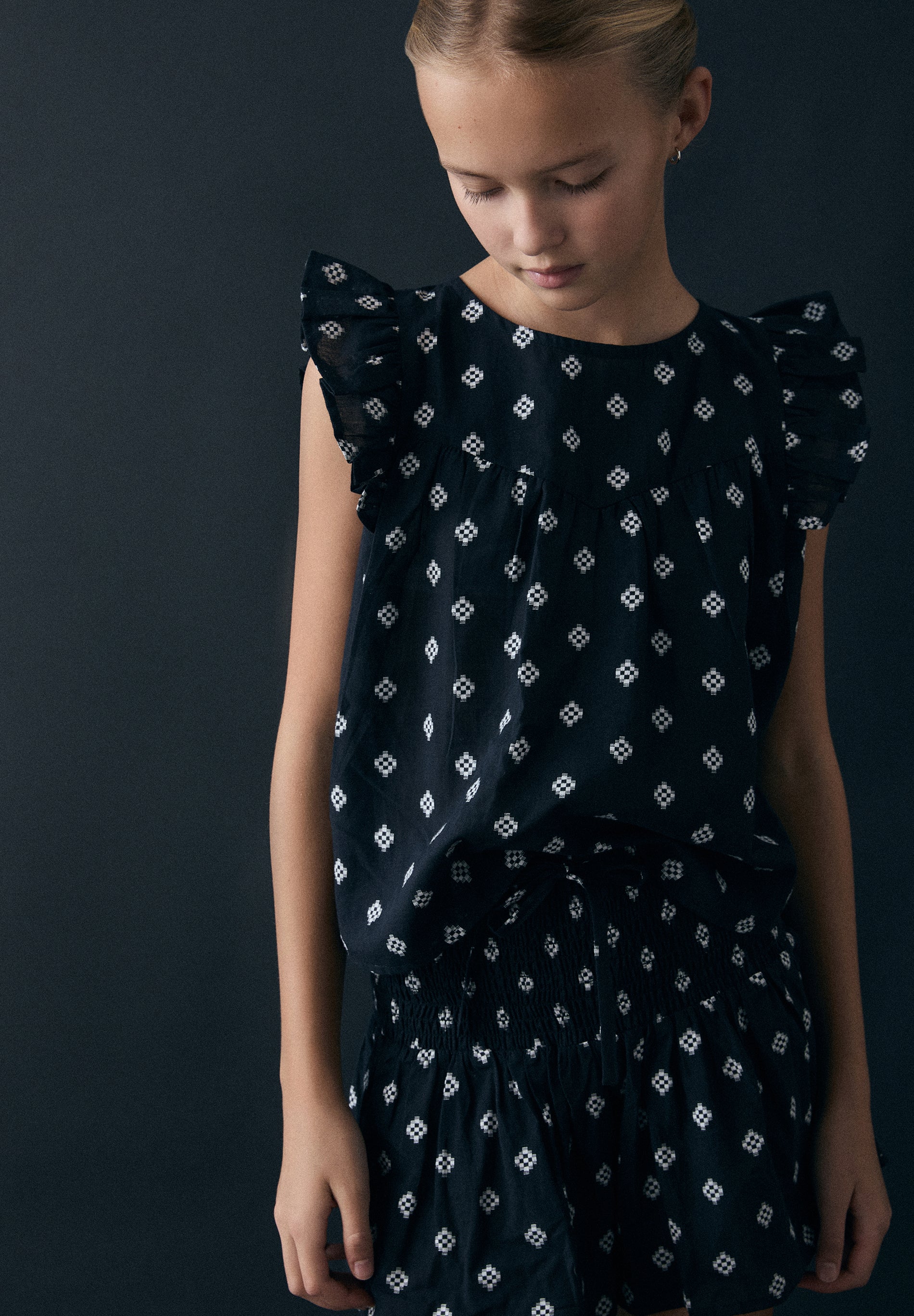 SLEEVELESS JACQUARD BLOUSE